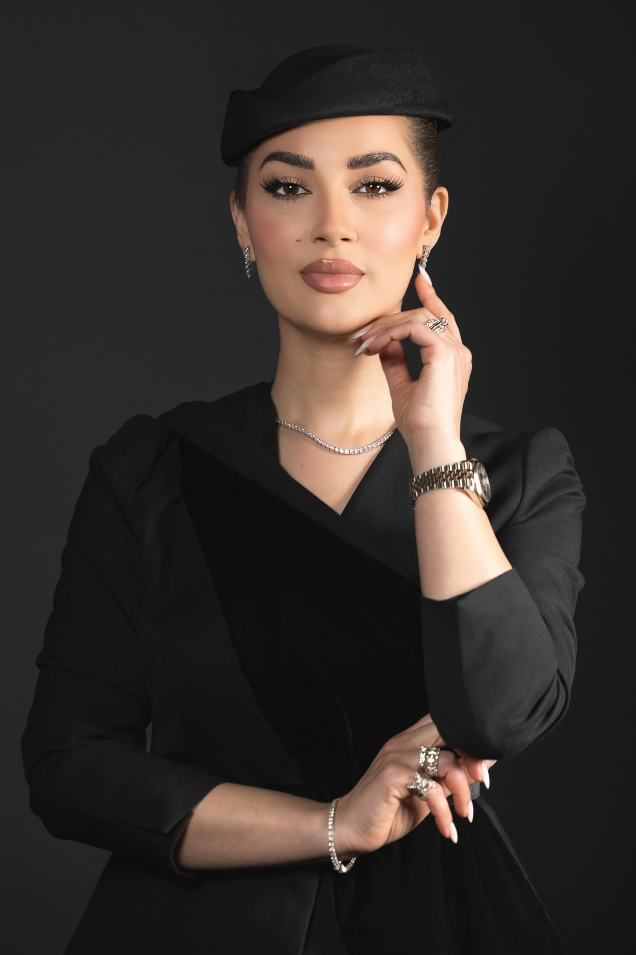 Studio portrait in a black hat
