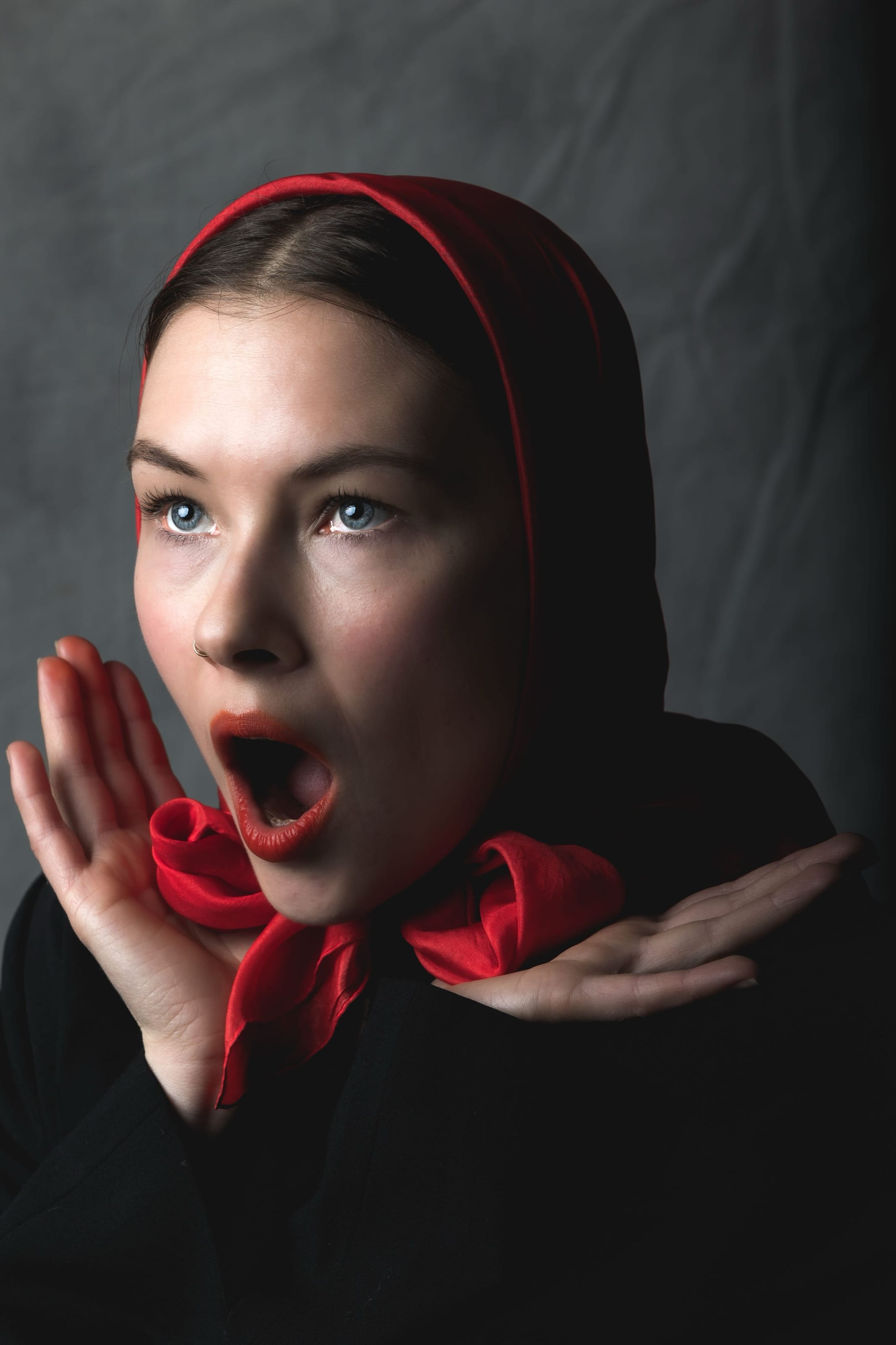 Studio portrait, red headpiece
