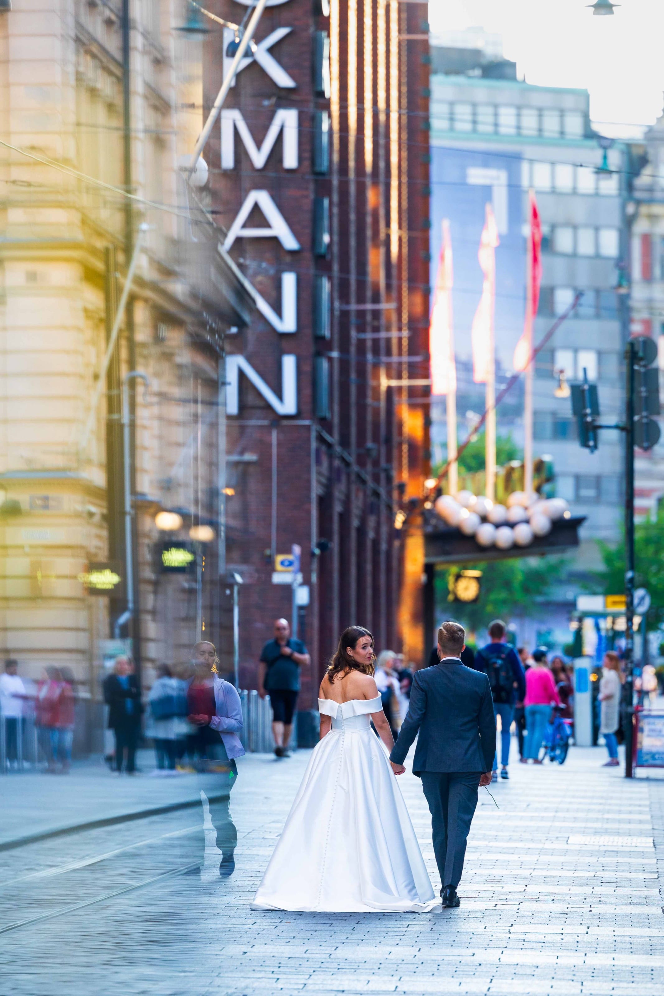 Couple walking down a city street